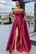 Robe longue de bal fendue sans bretelles avec poches