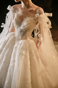 Elegant Off-Shoulder Ball Gown Wedding Dress with Tulle Cape & Bow Details