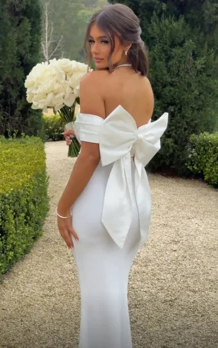 Vestido de noche elegante blanco sin tirantes, ajustado tipo sirena, con lazo Y7653