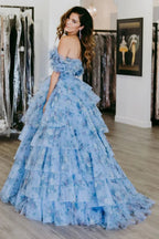 Sigourney | Vestido largo de gala azul con flores, corte en línea A y volantes en capas