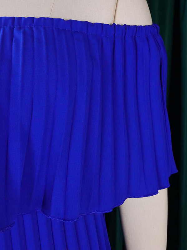 Abito da sera a spalle scoperte con drappeggio plissettato in tinta unita