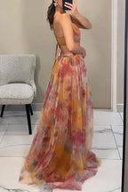 Vestido Maxi Giselle em Tule com Estampa Floral, Cintura Recortada e Abertura com Laços nas Costas