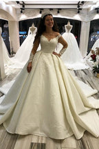 Glamorous Long Sleeves Satin Princess Wedding Dress With Appliques