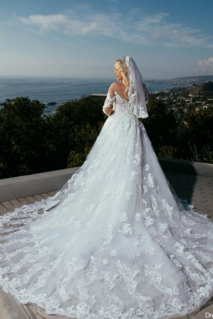Vestido de novia princesa de corte A con escote corazón y mangas largas con encaje