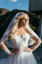 Vestido de novia princesa de corte A con escote corazón y mangas largas con encaje