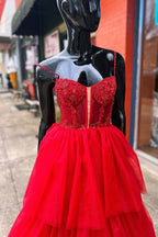 Abito lungo da sera a balze con corsetto ricamato a paillettes