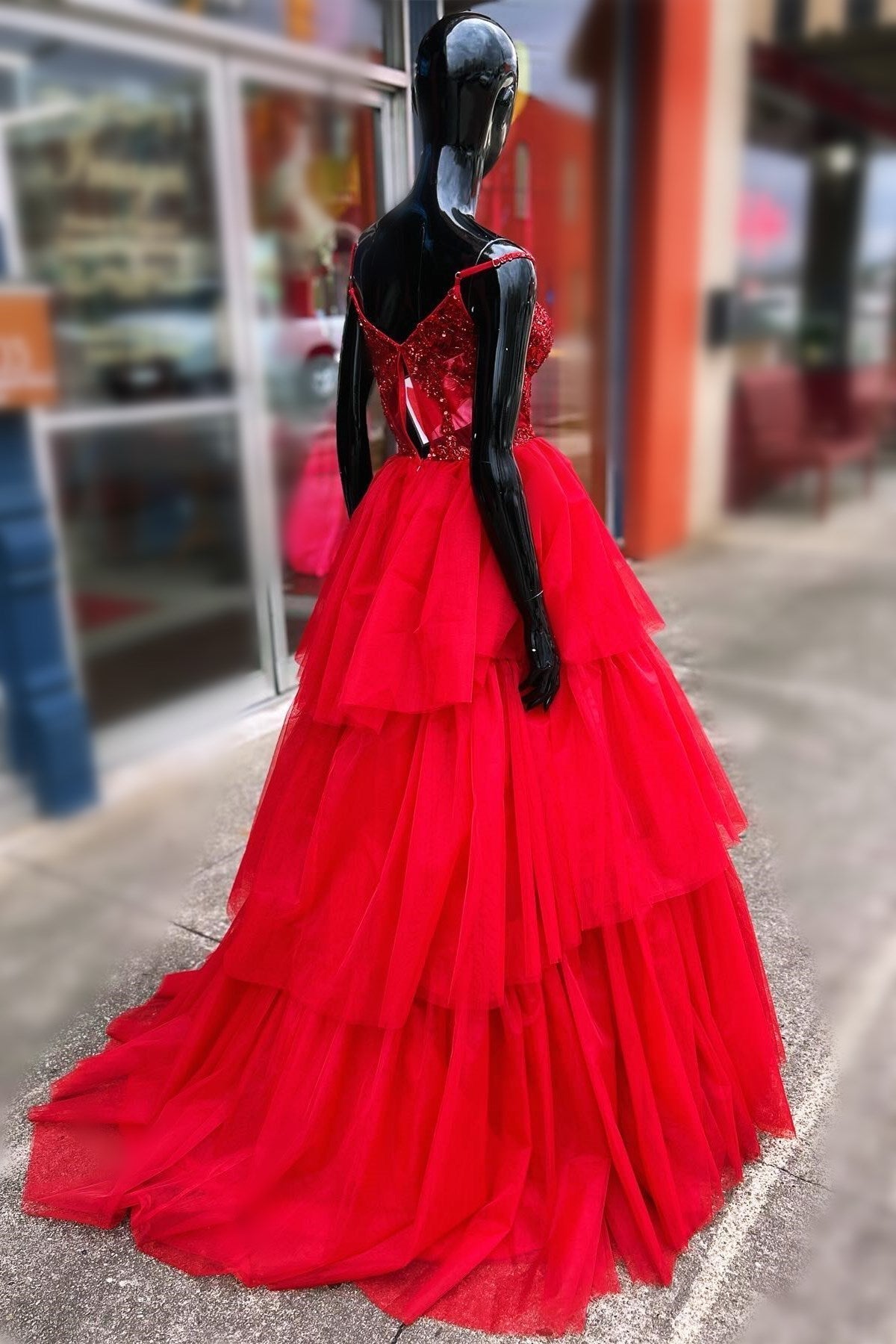 Abito lungo da sera a balze con corsetto ricamato a paillettes