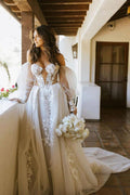Vestido de novia bohemio con hombros descubiertos, mangas largas y apliques de encaje