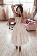Robe de bal rose perle en tulle, coupe évasée, bretelles fines, longueur thé