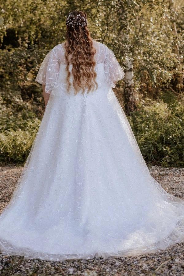 Plus Size White A-Line Wedding Dress V Neck Flutter Cape Sleeves Floral Embroidery Crystal Belt Glitter Tulle Bridal Gown with Sweep Train