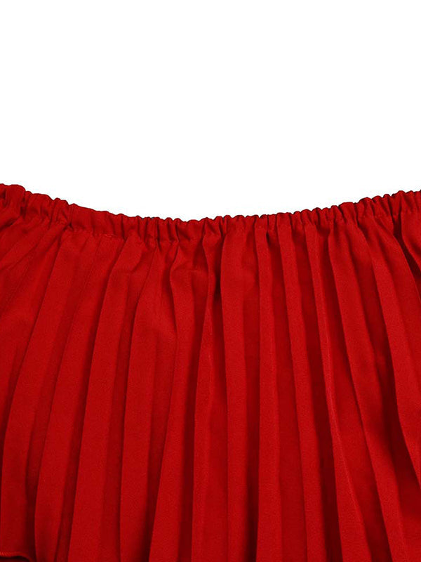Abito da sera a spalle scoperte con drappeggio plissettato in tinta unita