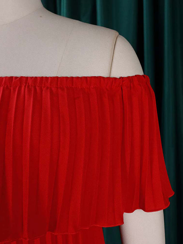 Abito da sera a spalle scoperte con drappeggio plissettato in tinta unita