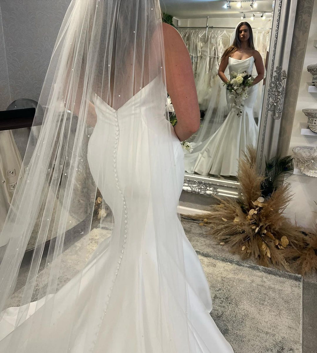 Elegant Floor Length Sleeveless Mermaid Satin Wedding Dress with Ruffles