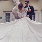 Abito da sposa elegante lungo a linea ad A, scollato sulle spalle, senza schiena, con applicazioni in pizzo e maniche