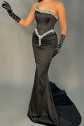 Robes de soirée longues élégantes noires sans manches en forme de sirène ornées de paillettes