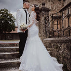 Elegante vestido de novia largo de sirena con encaje y espalda abierta con mangas
