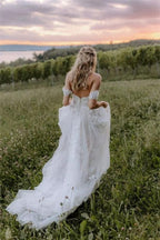 Robe de mariée élégante longue asymétrique en tulle avec dentelle florale