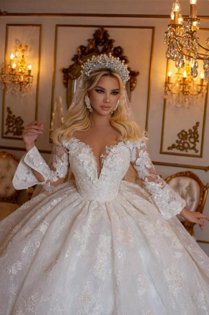 Elegante vestido de novia de encaje con mangas largas y escote corazón