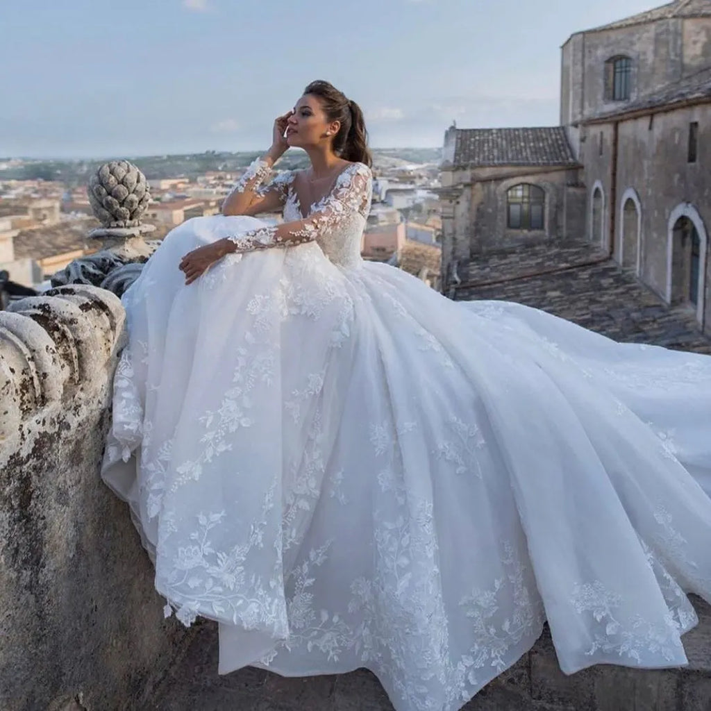 Princess Long Sleeve Wedding Dress With Sweetheart Neckline And Floral Lace
