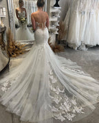 Robe de mariée sirène sans manches longue jusqu'au sol avec décolleté en cœur et dentelle magnifique