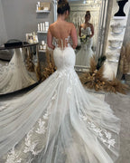 Robe de mariée sirène sans manches longue jusqu'au sol avec décolleté en cœur et dentelle magnifique