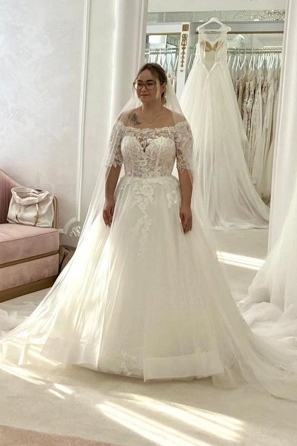Ivory Off The Shoulder A Line Wedding Dress With Appliques And Chapel Train
