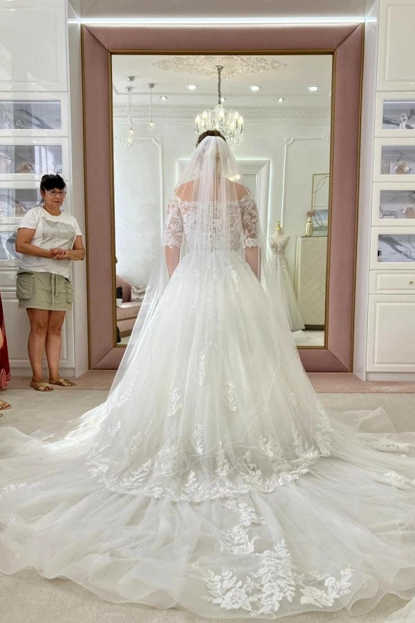 Ivory Off The Shoulder A Line Wedding Dress With Appliques And Chapel Train