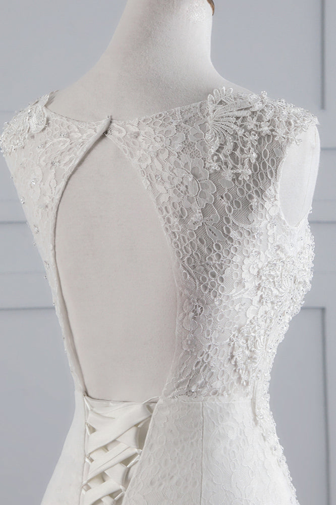 Abito da sposa lungo a sirena con pizzi e applicazioni in tulle scintillanti
