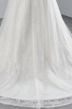 Abito da sposa lungo a sirena con pizzi e applicazioni in tulle scintillanti