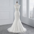 Abito da sposa lungo a sirena con pizzi e applicazioni in tulle scintillanti
