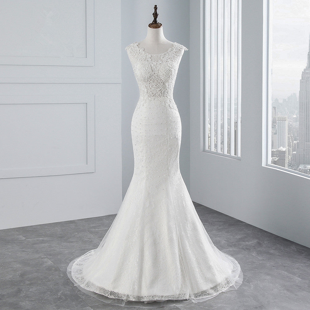 Abito da sposa lungo a sirena con pizzi e applicazioni in tulle scintillanti