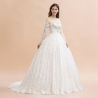 Robe de mariée blanche/crème en dentelle avec appliques perlées à manches longues et style élégant