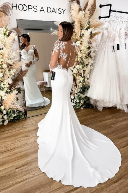 Robe de mariée sirène en dentelle florale avec manches longues et dos ajouré élégante