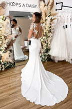 Robe de mariée sirène en dentelle florale avec manches longues et dos ajouré élégante