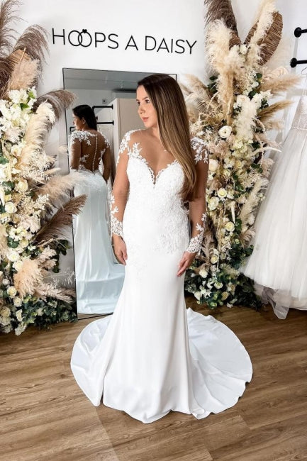 Robe de mariée sirène en dentelle florale avec manches longues et dos ajouré élégante