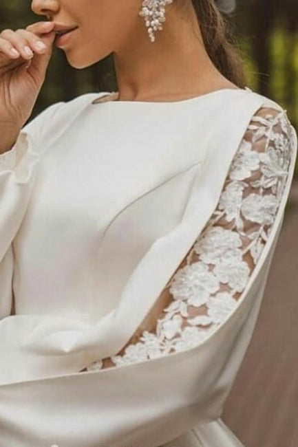 Magnifique robe de mariée blanche en satin à manches longues et coupe trapèze avec applications