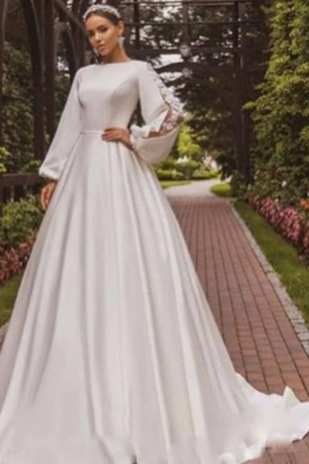 Magnifique robe de mariée blanche en satin à manches longues et coupe trapèze avec applications