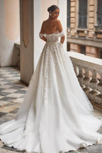 Magnifique robe de mariée en tulle avec appliques en dentelle, décolleté bardot, coupe évasée