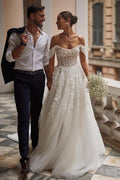 Magnifique robe de mariée en tulle avec appliques en dentelle, décolleté bardot, coupe évasée