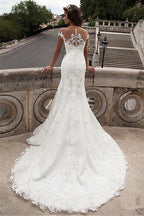 Vestidos de novia largos de sirena con encaje y escote ilusión
