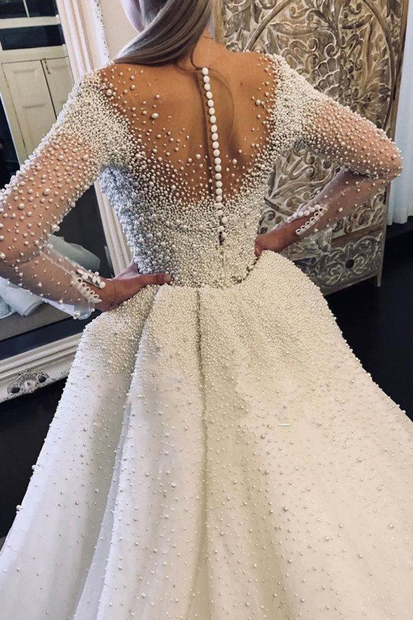 Abito da sposa con maniche lunghe avorio, scollo a V, bottoni, strascico spedibile e perle completamente ricoperte