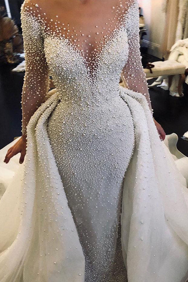 Abito da sposa con maniche lunghe avorio, scollo a V, bottoni, strascico spedibile e perle completamente ricoperte