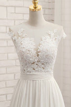 Vestido de novia largo de gasa con encaje, apliques y corte en A con abertura