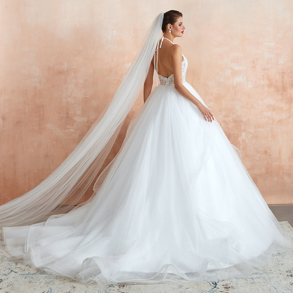 Vestido de novia largo de tul con escote halter, espalda abierta y apliques