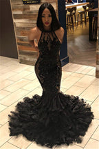 Robe de bal noire longue sirène à col halter avec dos ouvert et appliques