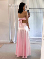 Nadine | Vestido de fiesta sin tirantes rosa con lazo en la espalda y falda en línea A de satén