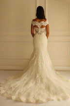 Robe de mariée sirène en dentelle avec manches courtes et traîne, épaules dénudées