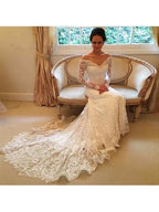 Vestido de novia de encaje con mangas largas y hombros descubiertos 