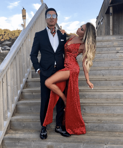 Robe de bal rouge longue à col en V, dos nu pailleté, coupe sirène avec fente