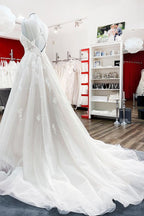 Ivory Spaghetti Strap Tulle V Neck Lace Ruffles Wedding Dress A Line